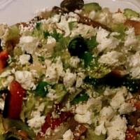 Greek Salad · Romaine lettuce, cucumbers, tomatoes, mixed bell peppers and olives, topped with feta cheese.