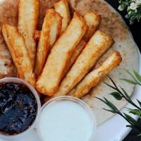 Halloumi Cheese Stix · Imported Halloumi Cheese fried and served with our house baked Pita, specialty Fig Jam, and ...