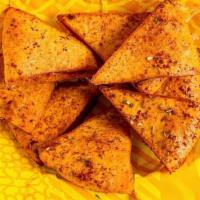 Pita Chips · Our house pita, fried and tossed with Zaatar & Sumac.