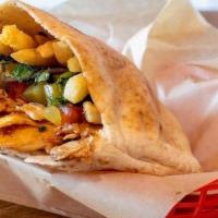 The Esquire · Our Chicken shawarma in pita,. stuffed with french fries, parsley mix,. tomatoes & pickled c...