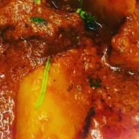Lamb Vindaloo (With Rice) · Very hot lamb curry cooked with potatoes and touch of lemon juice.