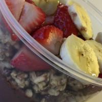 Acai Bowl · Blended frozen acai berries, topped w granola, bananas, strawberries and honey.