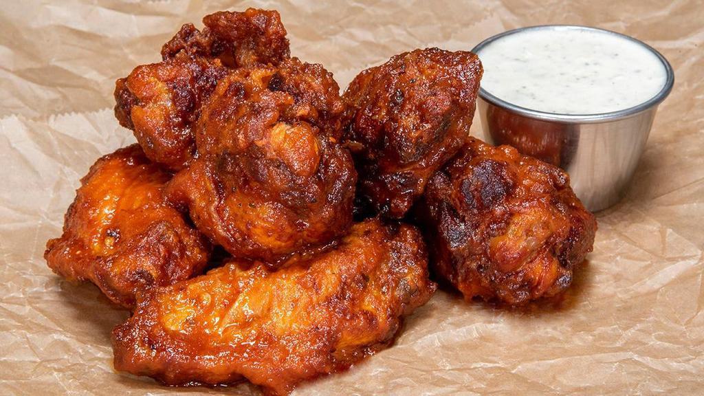 Haus Buffalo Wings · Classic Bone-In Wings in our haus buffalo sauce; served with a choice of dipping sauce