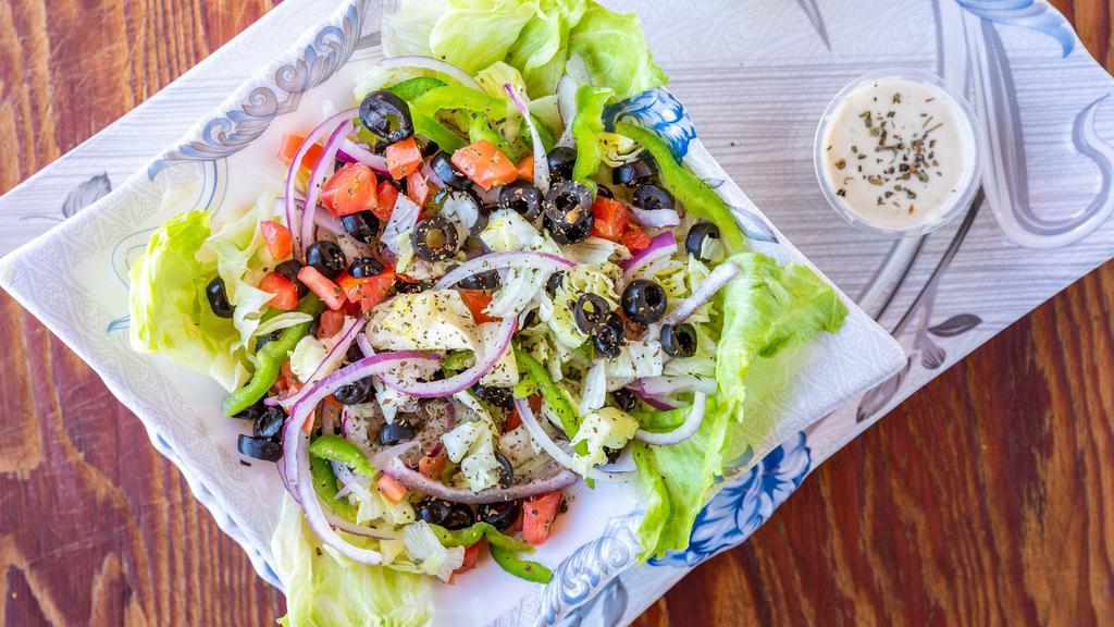 Greek Salad · Fresh lettuce, red onions, bell peppers, black olives, tomatoes, mushrooms, mozzarella cheese, feta cheese.