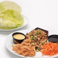 Lettuce Wraps · Marinated diced chicken breast, julienne carrots, green onions, cashews, and wonton strips. ...