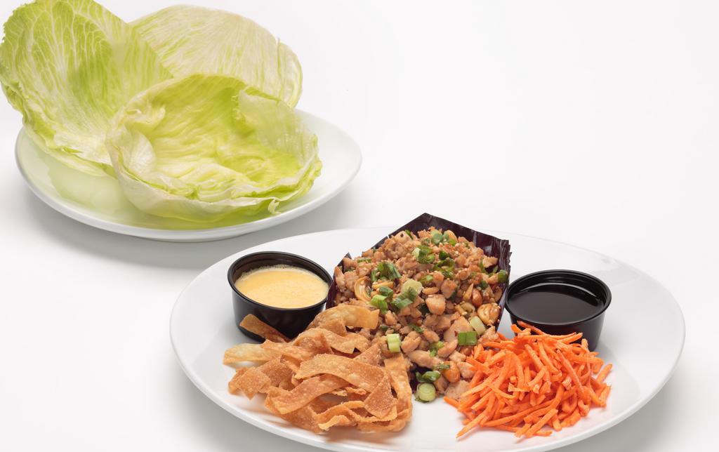 Lettuce Wraps · Marinated diced chicken breast,
Julienne carrots, green onions,
cashews, and wonton strips. Served
with iceberg lettuce cups, our own
sesame soy sauce, and spicy
mustard for dipping.