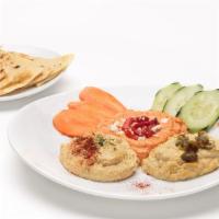 Hummus Trio · Roasted red pepper, south-western, and roasted garlic hummus. Served with homemade herb chip...
