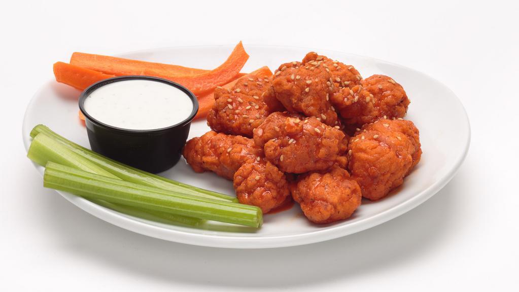 Boneless Wings · All white meat boneless wings tossed in one of our signature sauces, sprinkled with toasted sesame seeds and served with carrots, celery and a side of our ranch dip.