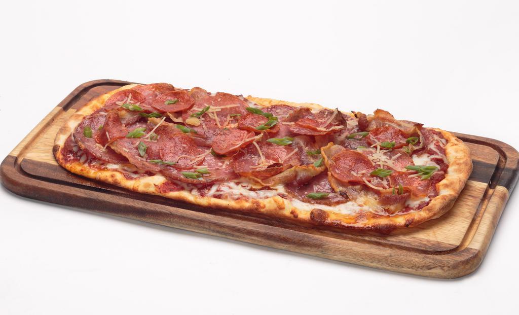 Charcuterie Flatbread · Our homemade pizza sauce,
topped with Genoa salami,
soppressata, pepperoni, and
pancetta. Finished with shredded
Parmesan cheese and green
onions.