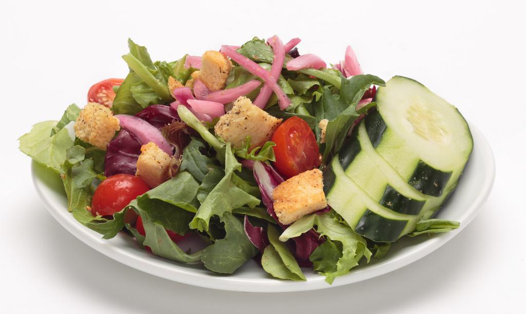 Oggi’S Garden Salad · Spring mix blend tossed with fresh cucumber, pickled red onions, cherry tomatoes, and house made croutons.  Served with your choice of dressing  on the side and an Oggi's Garlic Knot.  All Oggi’s salad dressings are gluten-free.