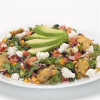 Southwestern Kale Salad · Thinly sliced kale and cabbage tossed in our spicy cilantro lime Greek yogurt dressing toppe...
