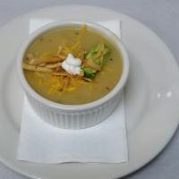 Chicken Tortilla Soup · Enjoy this south-of-the-border family classic, topped with cheddar, diced avocado and tortil...