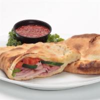 Custom Calzones · Ricotta, Mozzarella and Fontina cheeses sprinkled with grated Parmesan cheese.