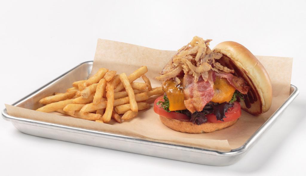 Texas Burger · 1/2 lb. of fresh angus beef hand-pattied Oggi's signature seasoning. Topped with BBQ sauce, crispy bacon, crispy homemade onion strings, melted cheddar cheese, spring mix blend and tomatoes. Served with choice of side.