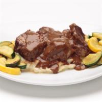 Beer-Braised Short Ribs · McGarvey’s Scottish Ale braised short ribs served with homemade roasted garlic mashed potato...