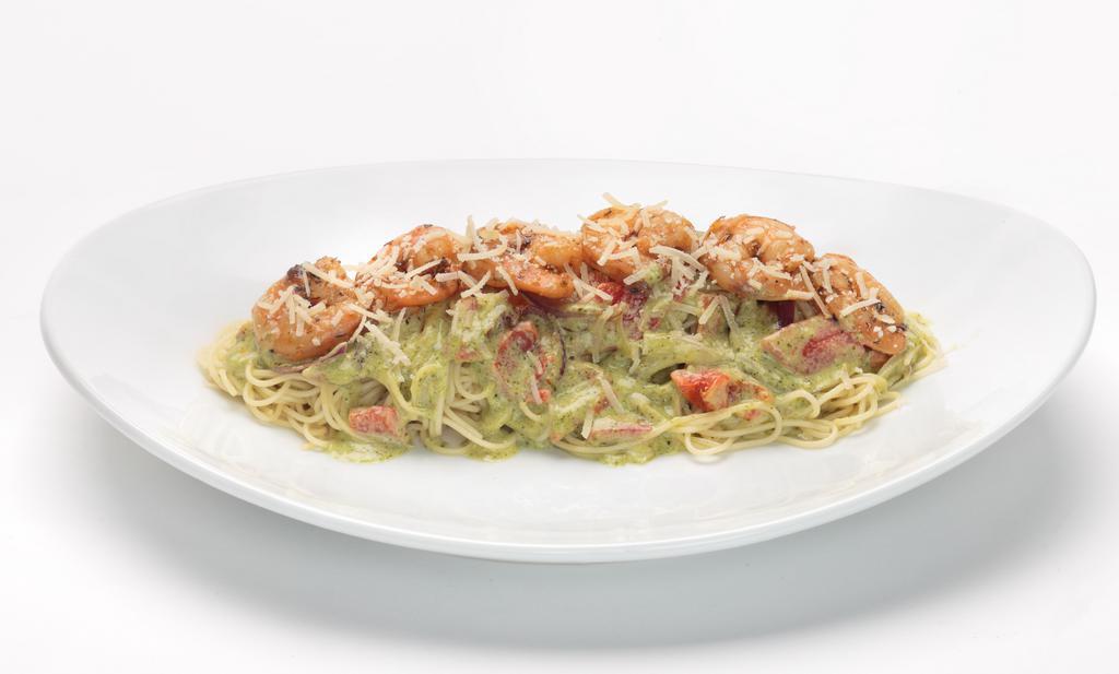 Pesto Shrimp Pasta · New. Angel hair pasta tossed in our homemade creamy pesto sauce with sautéed red bell peppers, red onion, and garlic. Topped with blackened shrimp and Parmesan.  Served with  an Oggi's Garlic Knot.