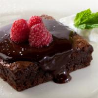 Oggi’S Fabulous Brownie · Decadent triple chocolate brownie,
topped with chocolate ganache and
fresh raspberries. Serv...