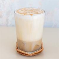 Iced Cappuccino · Hand-frothed milk over espresso with just a touch of simple syrup.