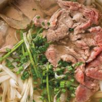 Phở Bò · Sliced eye of round steak meatball tendon rice noodle, cilantro, green onion.