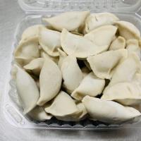 Cabbage & Pork Dumplings · 2 LBS
Hand-made wrappers, filled with nappa cabbage and pork grounded from pork shoulder in ...