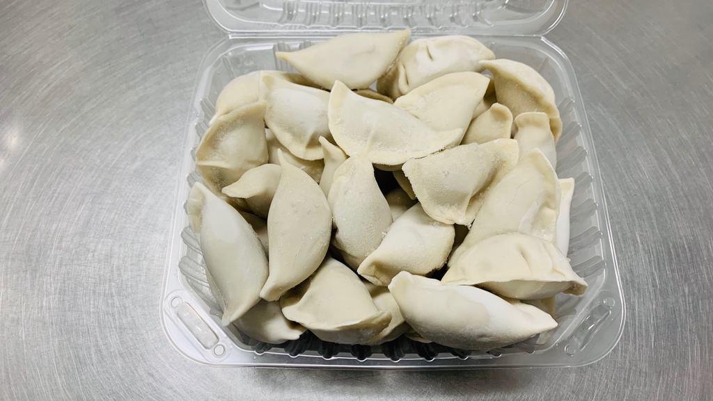 Cabbage & Pork Dumplings · 2 LBS
Hand-made wrappers, filled with nappa cabbage and pork grounded from pork shoulder in our store. NO MSG.

How to cook:
- Boil a large pot of water;
- Drop the frozen dumplings into boiling water;
- Stir genitally to prevent the dumpling stick to the bottom;
- When the dumplings float up, boil another two minutes;
- Drain the dumplings from water, serve with or without dipping sauce (dipping sauce not included).