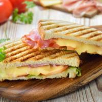 Hawaiian Grilled Cheese Sandwich With Bacon · Delicious, melted cheese, topped with grilled pineapple, ham, and crispy bacon, served on a ...