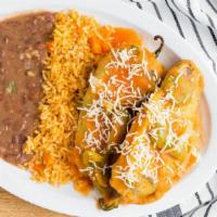 Chile Rellenos · 2 bell peppers grilled, deep-fried, stuffed with melted cheese, and smothered with mild toma...