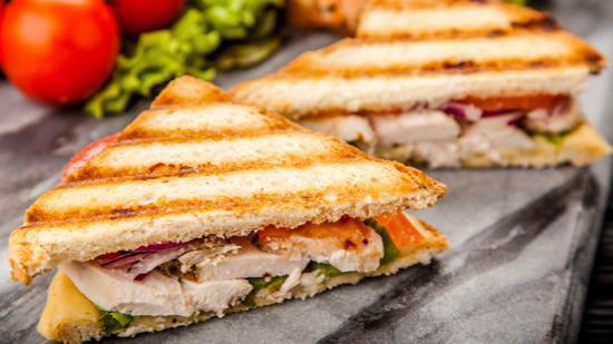 Grilled Chicken Breast Sandwich · Hearty grilled chicken and locally grown tomatoes and lettuce loaded between toasted buns along with choice of side.