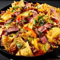 Nachos · Super nachos with crispy tortilla chips loaded with fresh avocado, pico de gallo, choice of ...