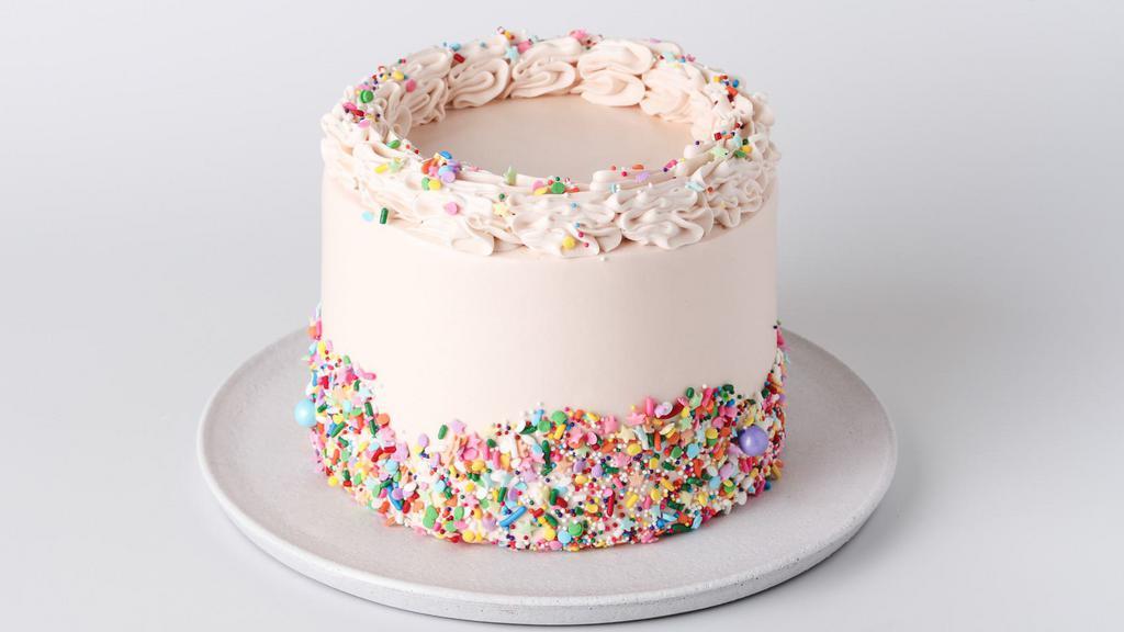 Vanilla Crème Cake · Yellow butter cake with layers of vanilla pastry cream and whipped cream, frosted with vanilla buttercream and decorated with candy confetti. For Cake Writing (Only 30 characters for cake writing) please indicate on the special instruction.