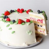 Slice Triple Berry Cake · Yellow butter cake layered with lightly sweetened whipped cream, fresh blueberries, raspberr...