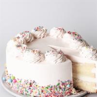 Slice Vanilla Creme Cake · Yellow butter cake with layers of vanilla pastry cream and whipped cream, frosted with vanil...