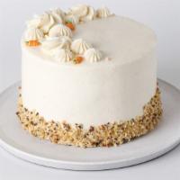 Carrot Cake · Rich carrot cake full of spices, walnuts and raisins, layered with walnut-caramel filling an...