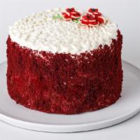 Red Velvet Cake · Rich and red buttermilk cake with layers of cream cheese filling and frosting, decorated wit...