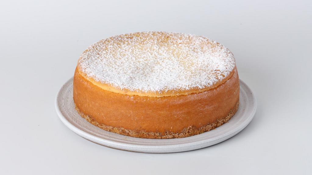 New York Cheesecake · New York style cheesecake with a hint of citrus zest in a delicious graham cracker crust. For Cake Writing (Only 30 characters for cake writing) please indicate on the special instruction.