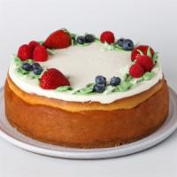 Slice Triple Berry Cheesecake · Fresh raspberries, blueberries, and strawberries in a vanilla cheesecake with whipped cream ...