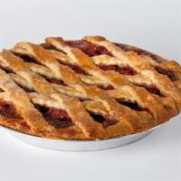Slice Cherry Pie · A golden latticework top crust reveals the sweet-tart cherry filing, simmered to perfection.