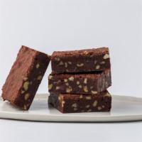 Brownie W/ Nuts · A Cordillera dark chocolate brownie with toasted walnuts and a hint of espresso, topped with...
