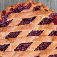 Slice Of Cherry Pie · Slowly-simmered sweet and tart cherries
under a lattice double baked butter crust