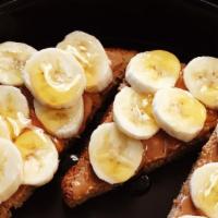 Nutty Monkey · Whole wheat toast with organic peanut butter, honey & sliced banana [VEG]
