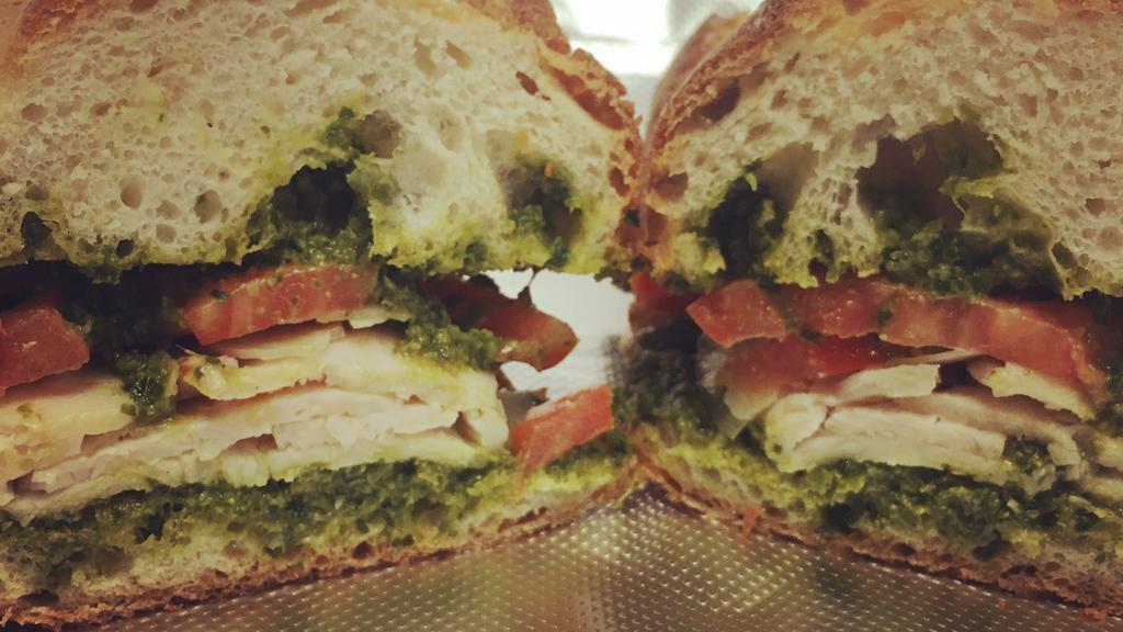 Chicken Pesto Sandwich (Grilled) · sliced chicken breast, parmesan cheese & tomato with house made pesto on a French baguette