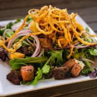 Steak · Mixed greens, smoked tri tip, bleu cheese crumbles, red onions, balsamic dressing and topped...