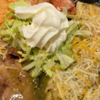 Charros Meal #1 · Choose 2 items: enchilanda or taquitos, Tacos, chile relleno,Tamale, refried beans and rice