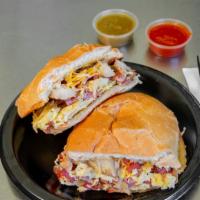 Breakfast Sandwich  · Ham or bacon, Sausage or Chorizo, or Carnitas eggs, cheese, and potato.