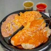 Chile Relleno / Stuffed Chili Plate · Chile rellenos , Refried beans, rice and cheese.