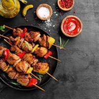 The Lamb Kebab · Sizzling two lamb skewers marinated with lamb kebab, paprika, salt and olive oil. Served wit...