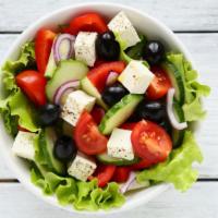 Greek Salad · Chopped tomatoes, cucumbers, onions and fresh squeezed lemon juice.