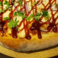 Bbq Chicken Pizza · BBQ sauce, red onions, fresh cilantro, chicken and mozzarella cheese.