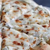 Riccotta Pizza · Mozzarella Cheese, Ricotta Cheese, Cilantro, Garlic Olive Oil Sauce