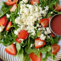 Strawberry Spinach Salad · arugula,spinach,strawberry,almonts,rasberryvinagrette dressing